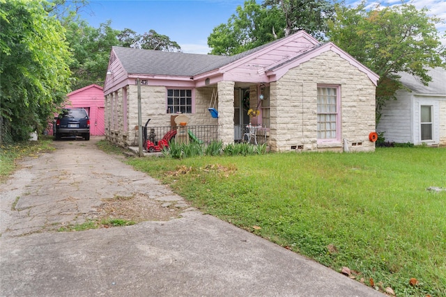 1343 Arizona Ave, Dallas, TX 75216 - ranch-style house with asphalt driveway, stone siding, roof with shingles, and a front lawn