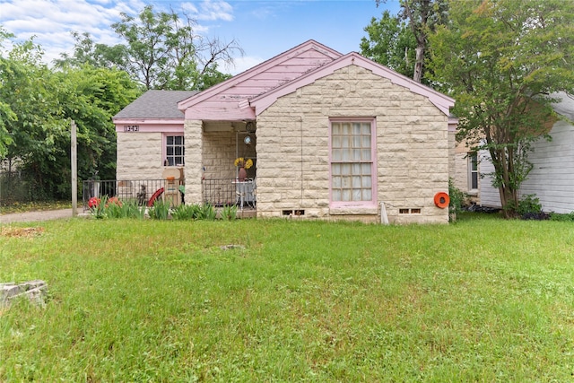 1343 Arizona Ave, Dallas, TX 75216 - bungalow with stone siding and a front lawn