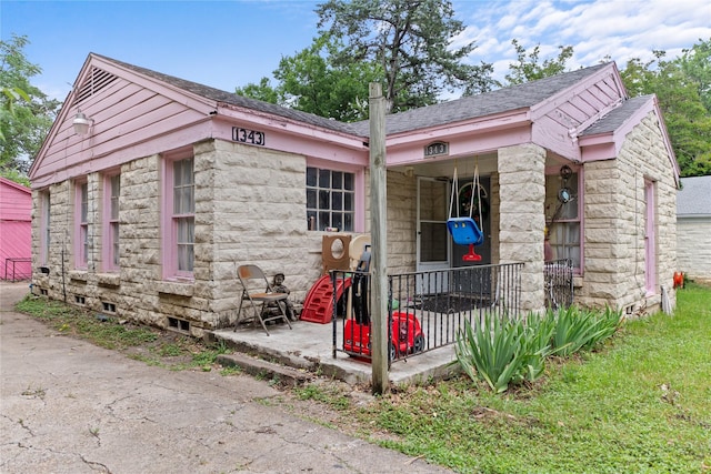 1343 Arizona Ave, Dallas, TX 75216 - view of property exterior with stone siding and a shingled roof
