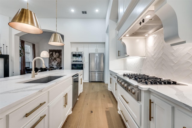 3201 Sunday Silence Ln, Celina, TX 75009 - kitchen with stainless steel appliances, a sink, tasteful backsplash, white cabinetry, and recessed lighting