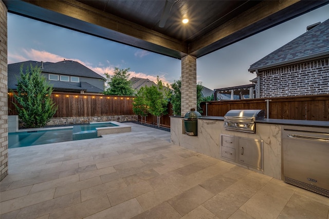 3201 Sunday Silence Ln, Celina, TX 75009 - patio terrace at dusk with a fenced backyard, a patio, and a hot tub