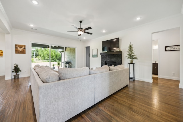 418 Sundance Trl, Sunnyvale, TX 75182 - living room featuring dark wood finished floors, ceiling fan, a fireplace, baseboards, and ornamental molding