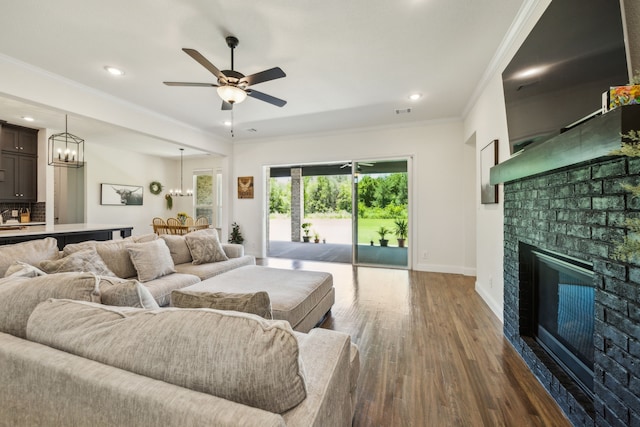 418 Sundance Trl, Sunnyvale, TX 75182 - living area featuring a fireplace, crown molding, dark wood finished floors, baseboards, and a ceiling fan