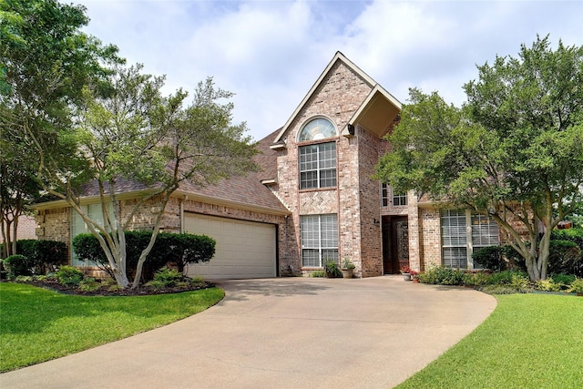4112 Paddington Ln, Colleyville, TX 76034 - traditional-style house with brick siding, driveway, a front yard, a garage, and a shingled roof