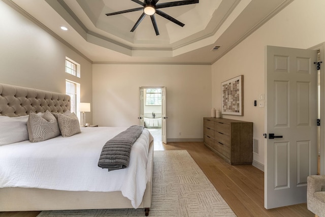 193 Asher Ct, Coppell, TX 75019 - bedroom with a raised ceiling, light wood-style floors, ornamental molding, recessed lighting, and baseboards