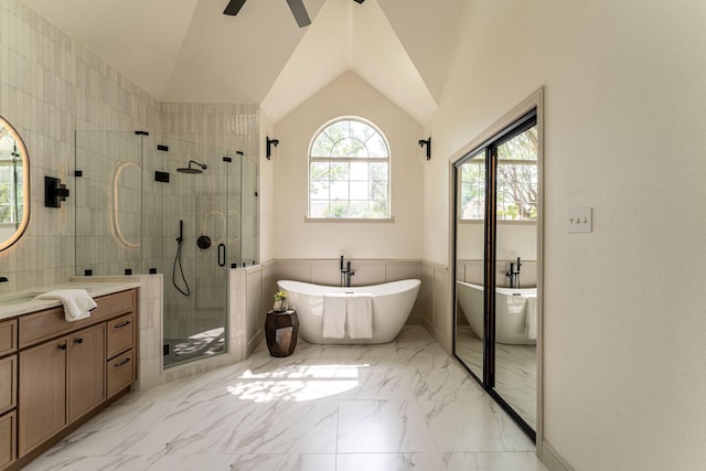 193 Asher Ct, Coppell, TX 75019 - bathroom featuring a shower stall, vanity, a soaking tub, marble finish floors, and lofted ceiling