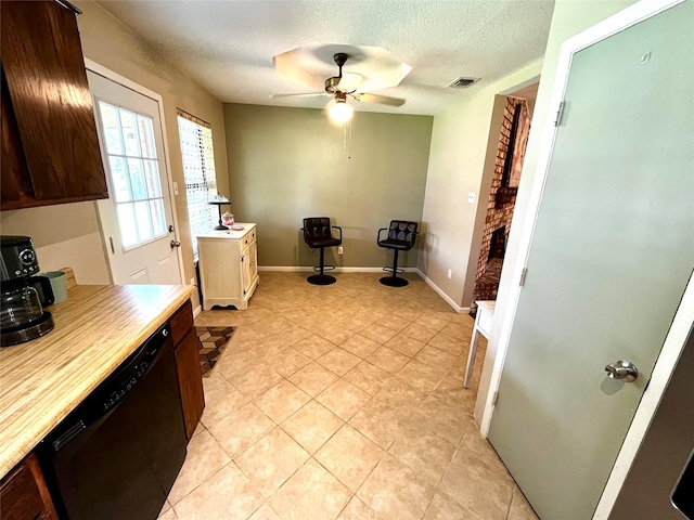 328 Branson Rd, Roanoke, TX 76262 - dining space featuring a ceiling fan, light tile patterned floors, a textured ceiling, and baseboards