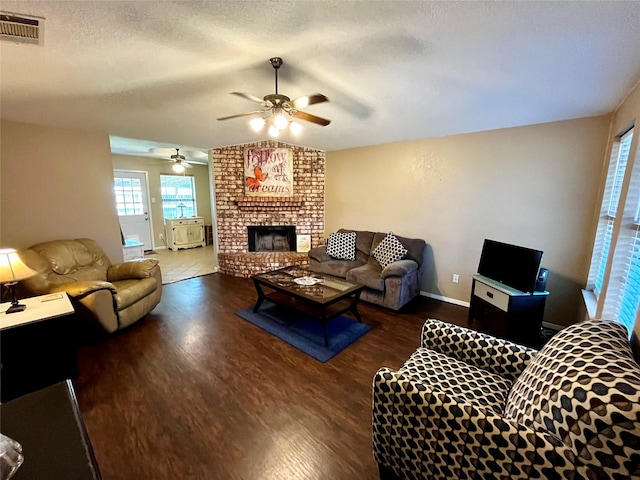 328 Branson Rd, Roanoke, TX 76262 - living area with wood finished floors, ceiling fan, a brick fireplace, and baseboards