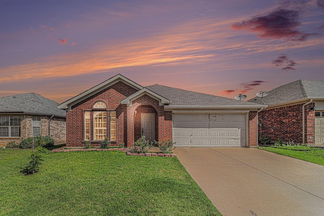 4720 Topaz Ln, Granbury, TX 76049 - view of front of property with brick siding, a garage, driveway, and a lawn