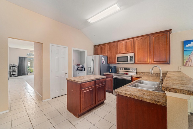 4720 Topaz Ln, Granbury, TX 76049 - kitchen with stainless steel appliances, a sink, washing machine and dryer, lofted ceiling, and light tile patterned flooring