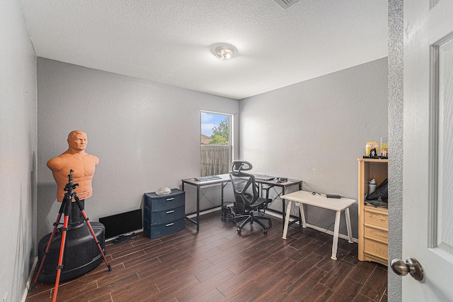 4720 Topaz Ln, Granbury, TX 76049 - home office with wood finished floors, a textured wall, and a textured ceiling