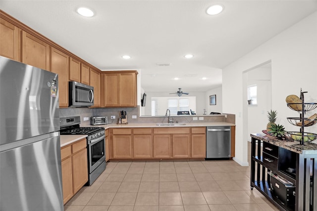 8857 Shore Crest Rd, Frisco, TX 75036 - kitchen with stainless steel appliances, a sink, ceiling fan, recessed lighting, and light countertops