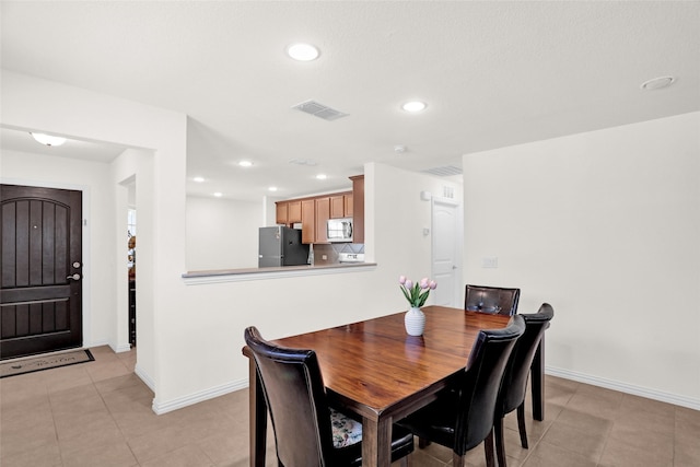 8857 Shore Crest Rd, Frisco, TX 75036 - dining area with baseboards, recessed lighting, and light tile patterned floors