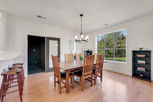 3829 Fm 896, Leonard, TX 75452 - dining space featuring light wood finished floors, a chandelier, and baseboards