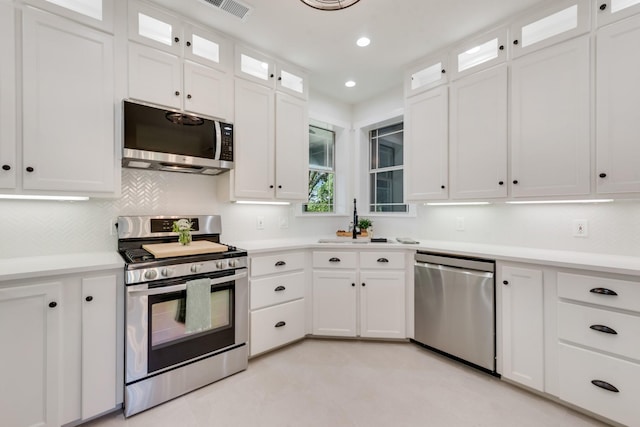 3829 Fm 896, Leonard, TX 75452 - kitchen with appliances with stainless steel finishes, a sink, light countertops, white cabinets, and recessed lighting