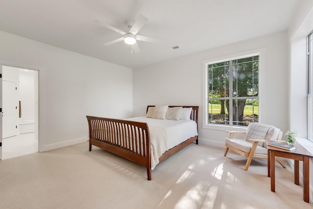 3829 Fm 896, Leonard, TX 75452 - bedroom featuring light colored carpet, baseboards, connected bathroom, and ceiling fan
