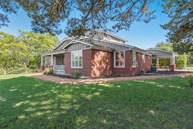 3829 Fm 896, Leonard, TX 75452 - back of house with board and batten siding, brick siding, a porch, a lawn, and central air condition unit