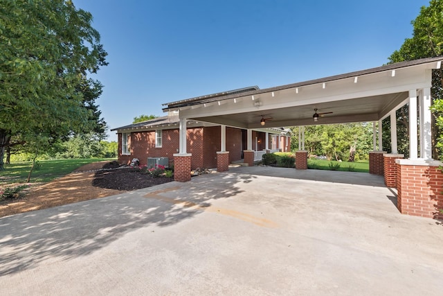 3829 Fm 896, Leonard, TX 75452 - view of front facade with a ceiling fan, concrete driveway, central AC unit, an attached carport, and brick siding