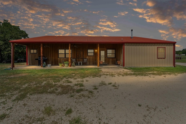 227 W Lipan Dr, Lipan, TX 76462 - rear view of house with board and batten siding