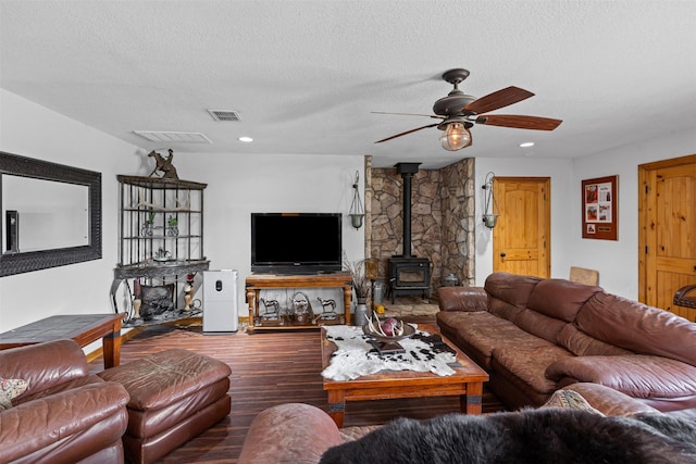 227 W Lipan Dr, Lipan, TX 76462 - living room featuring a wood stove, wood finished floors, a ceiling fan, a textured ceiling, and recessed lighting