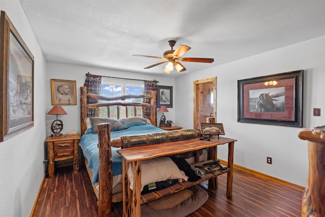 227 W Lipan Dr, Lipan, TX 76462 - bedroom featuring wood finished floors, baseboards, a ceiling fan, and a textured ceiling