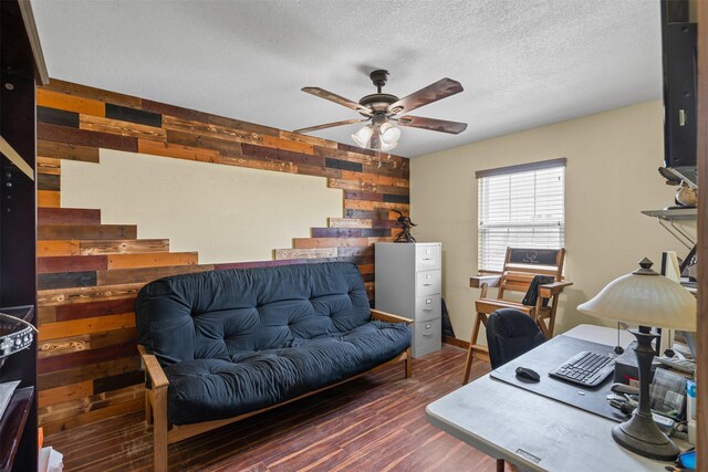 227 W Lipan Dr, Lipan, TX 76462 - office featuring wood walls, ceiling fan, wood finished floors, and a textured ceiling