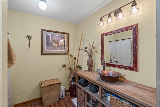 227 W Lipan Dr, Lipan, TX 76462 - corridor featuring wood finished floors, a sink, and baseboards