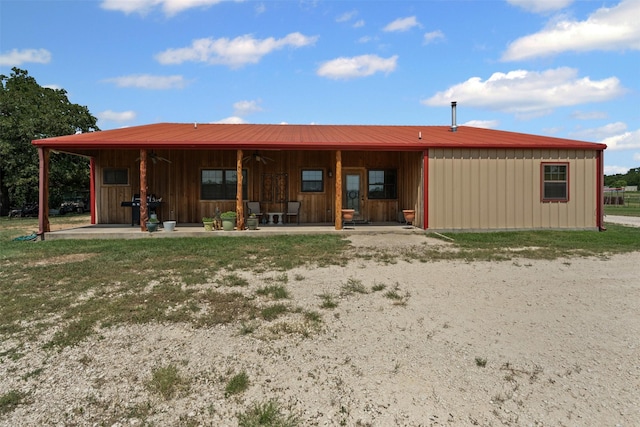 227 W Lipan Dr, Lipan, TX 76462 - rear view of house with board and batten siding