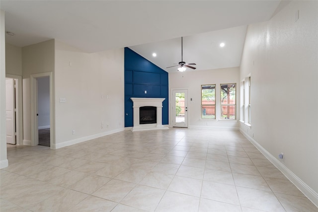 10909 Blake Gdns, Mckinney, TX 75072 - unfurnished living room with ceiling fan, light tile patterned floors, a large fireplace, baseboards, and high vaulted ceiling