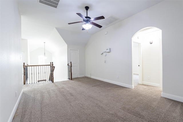 10909 Blake Gdns, Mckinney, TX 75072 - empty room with arched walkways, carpet, ceiling fan, vaulted ceiling, and baseboards