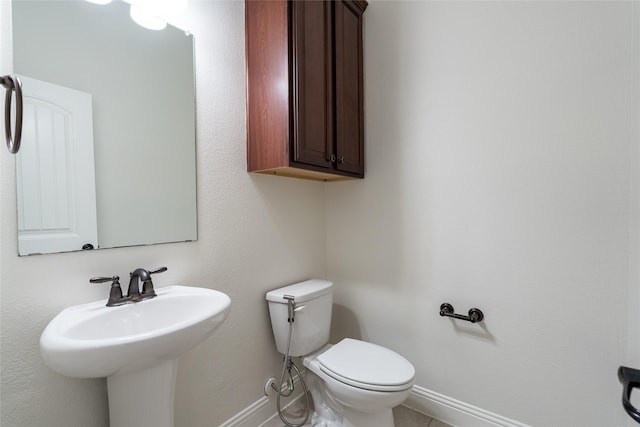 10909 Blake Gdns, Mckinney, TX 75072 - bathroom featuring baseboards and toilet