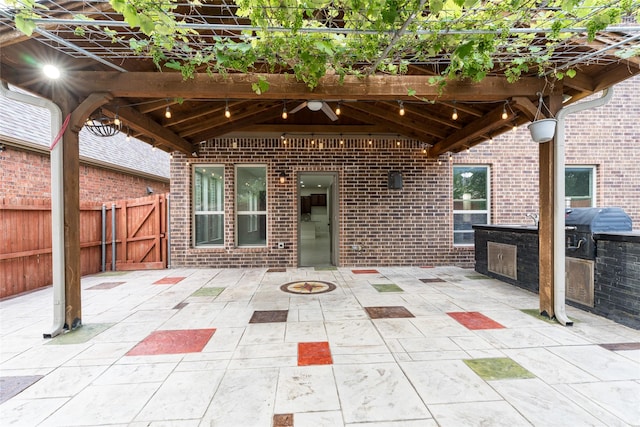 10909 Blake Gdns, Mckinney, TX 75072 - view of patio featuring grilling area, a fire pit, and a gate