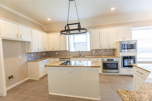 3015 Oak Dr, Rockwall, TX 75032 - kitchen featuring appliances with stainless steel finishes, light tile patterned floors, a sink, light stone countertops, and tasteful backsplash