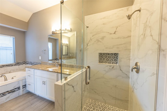 3015 Oak Dr, Rockwall, TX 75032 - full bath featuring a marble finish shower, vanity, a bath, lofted ceiling, and wood finished floors