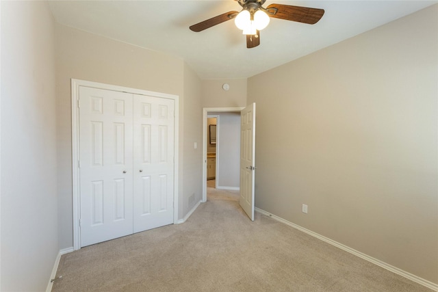 3015 Oak Dr, Rockwall, TX 75032 - unfurnished bedroom featuring light colored carpet, baseboards, a closet, and ceiling fan