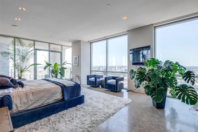 1717 Arts Plz Unit 2202, Dallas, TX 75201 - bedroom with a wall of windows, multiple windows, and tile patterned flooring