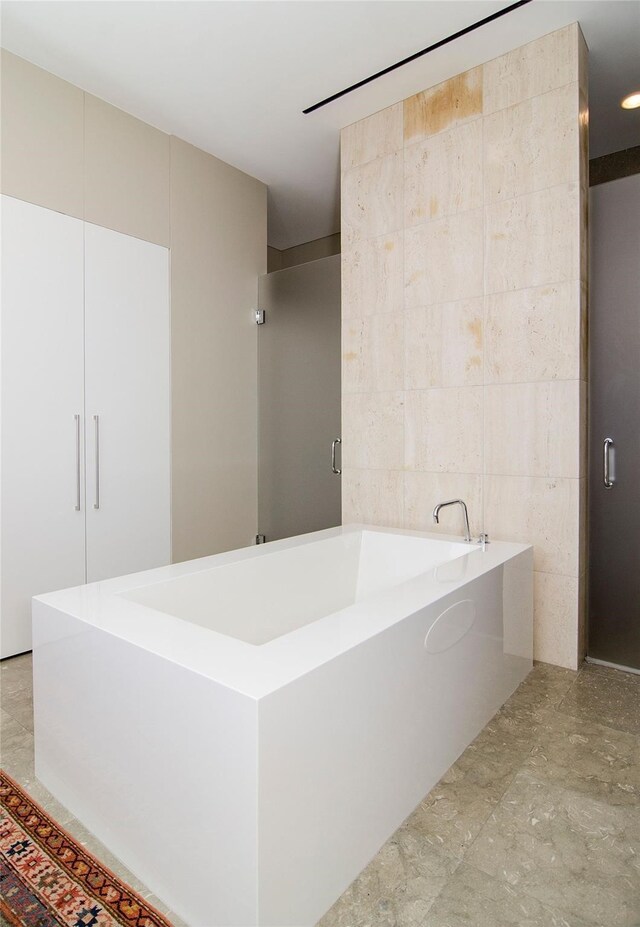 1717 Arts Plz Unit 2202, Dallas, TX 75201 - bathroom featuring a garden tub and a stall shower