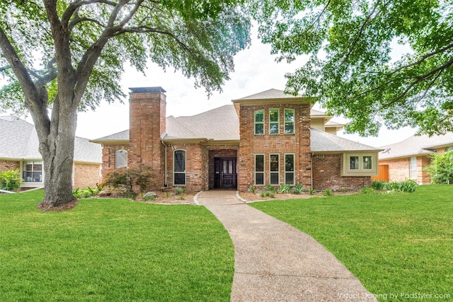 3308 Runabout Ct, Plano, TX 75023 - traditional-style house featuring a chimney, brick siding, roof with shingles, and a front lawn