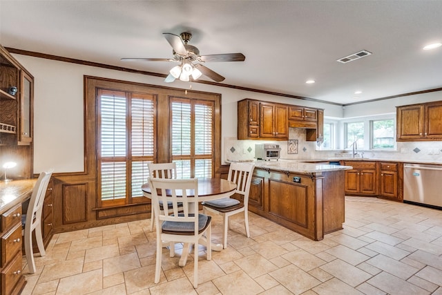 3308 Runabout Ct, Plano, TX 75023 - kitchen with stainless steel dishwasher, brown cabinets, a sink, ceiling fan, and backsplash