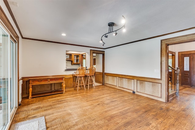 3308 Runabout Ct, Plano, TX 75023 - spare room with ornamental molding, wood finished floors, and a wainscoted wall