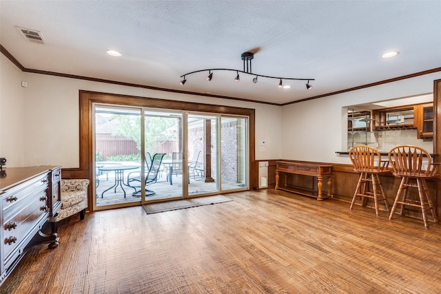3308 Runabout Ct, Plano, TX 75023 - dining space featuring ornamental molding, wood finished floors, and recessed lighting