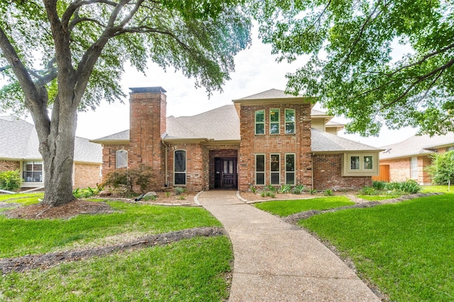 3308 Runabout Ct, Plano, TX 75023 - traditional-style home with a front lawn, a shingled roof, a chimney, and brick siding