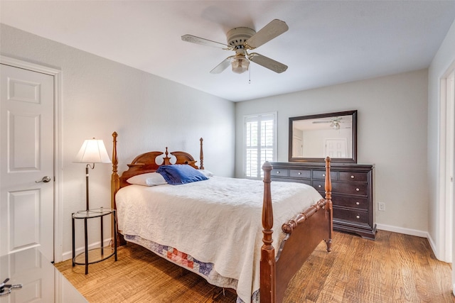 3308 Runabout Ct, Plano, TX 75023 - bedroom with wood finished floors, baseboards, and a ceiling fan