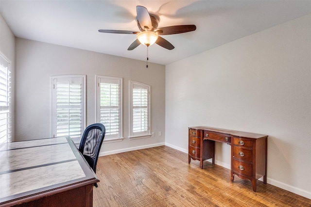 3308 Runabout Ct, Plano, TX 75023 - office area with ceiling fan, light wood finished floors, and baseboards