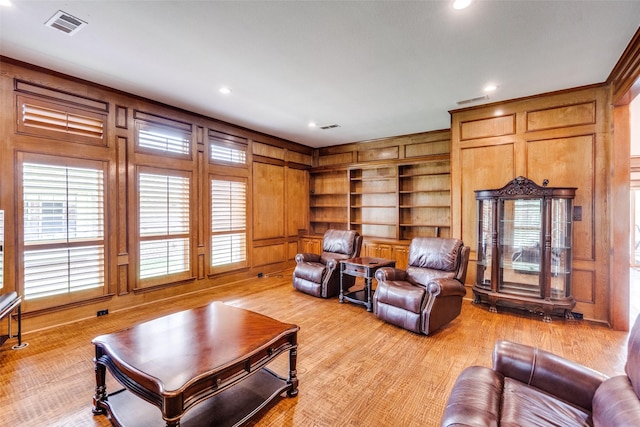 3308 Runabout Ct, Plano, TX 75023 - living area with built in features, light wood-style flooring, recessed lighting, and wooden walls