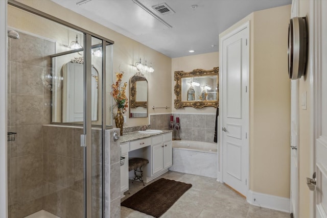 3351 Cascades Ct Unit 306, Tyler, TX 75709 - full bathroom with vanity, a stall shower, a garden tub, and tile patterned floors