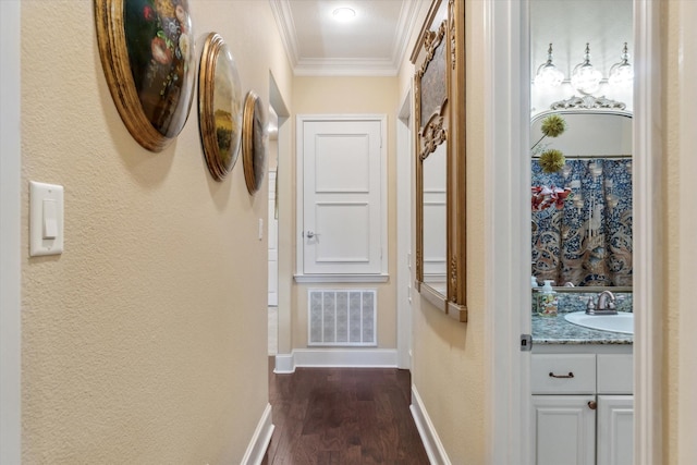 3351 Cascades Ct Unit 306, Tyler, TX 75709 - hallway featuring a sink, ornamental molding, dark wood-style floors, baseboards, and a textured wall