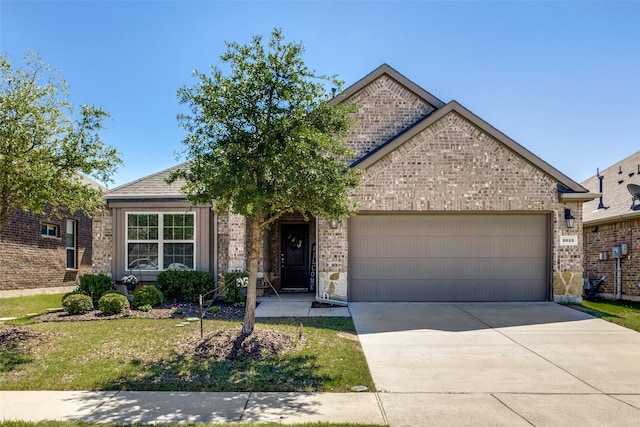 2613 Hillrich Dr, Anna, TX 75409 - view of front facade with brick siding, an attached garage, and driveway