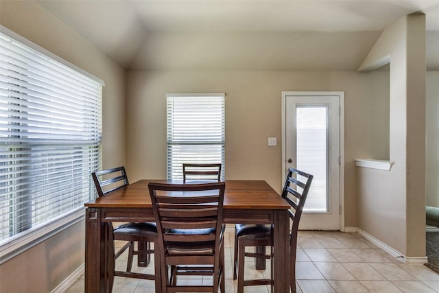 2613 Hillrich Dr, Anna, TX 75409 - dining area with vaulted ceiling, light tile patterned floors, and baseboards