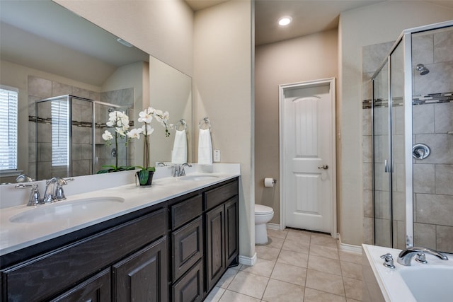 2613 Hillrich Dr, Anna, TX 75409 - bathroom featuring a shower stall, double vanity, tile patterned floors, a bath, and toilet